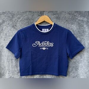 Authentic adidas Originals Baby Tee GRX in dark blue.
Size: L
Brand New!